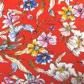 Coupon of Crepe back satin of polyester with floral pattern on a orange background 3m x 1.40m