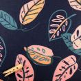 sCoupon of polyester jersey fabric printed with large stylized leaves on black background 3m x 1.40m