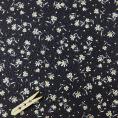 Coupon of cotton twill fabric printed with colored flowers on a navy background 3m x 1,40m