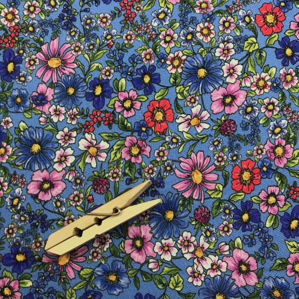 Coupon of viscose pique fabric with colorful flowery print on light blue background 1,50m or 3m x 1,40m
