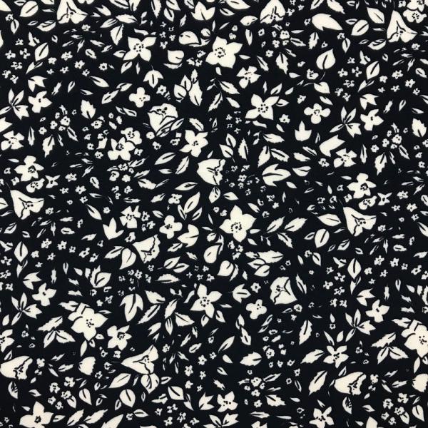 Coupon of polyester and elastane twill fabric with flowery prints on black background 1,50m or 3m x 1,40m