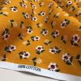 Coupon de tissu enCoupon de tissu en 100% coton imprimé avec motif de petites fleurs sur fond orange mandarine 1m50 ou 3m x 1m40