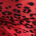 Coupon de tissu en dévoré de soie et viscose motif peau de panthère sur une base en satin rouge 3m x 1,40m