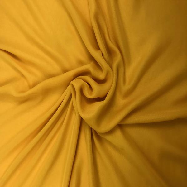 Coupon de tissu mousseline de soie et lycra jaune melon 3m x 1,40m